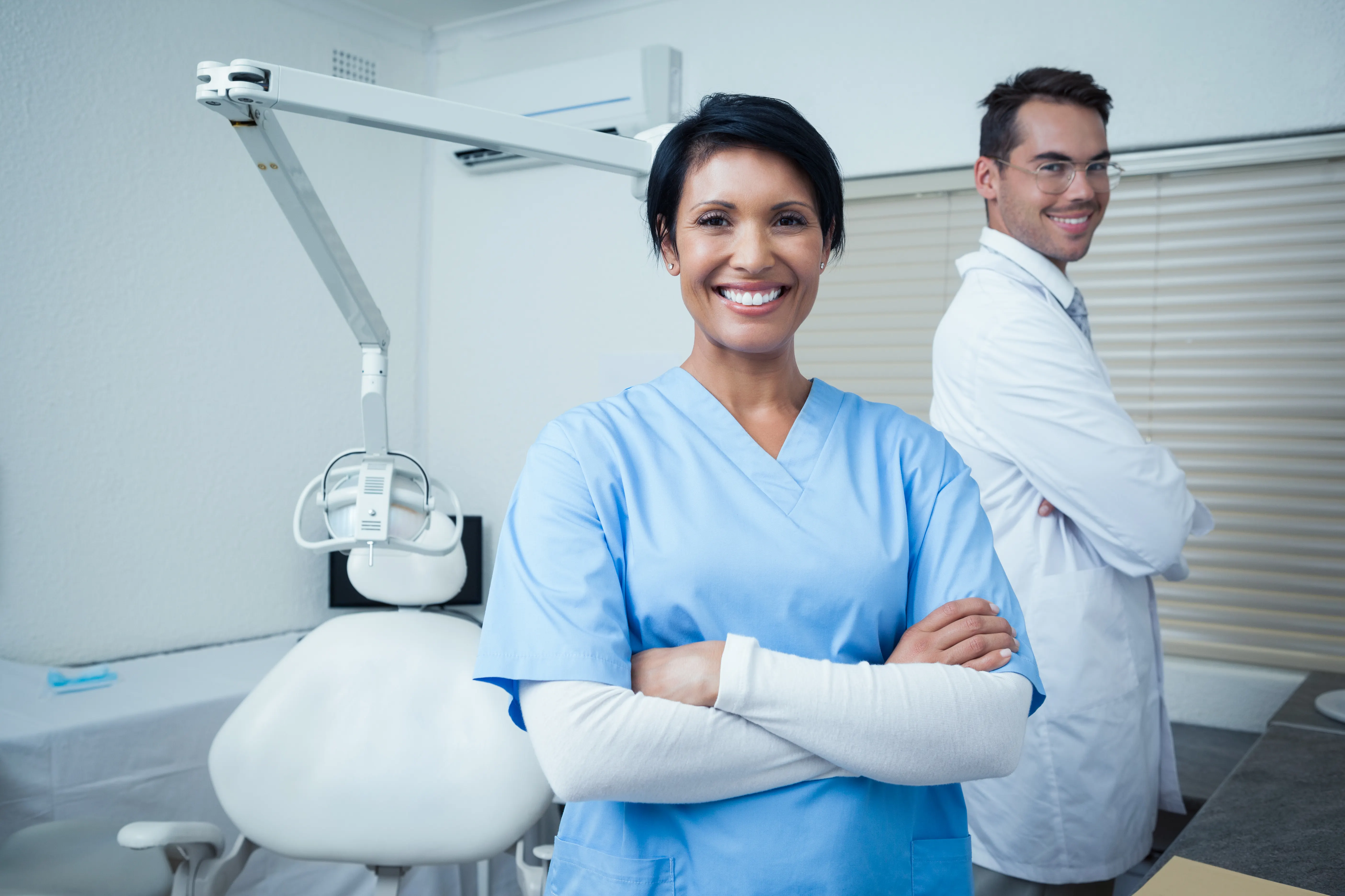 Two dental professionals in a modern clinic